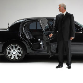 Photo of a limousine driving through the city
